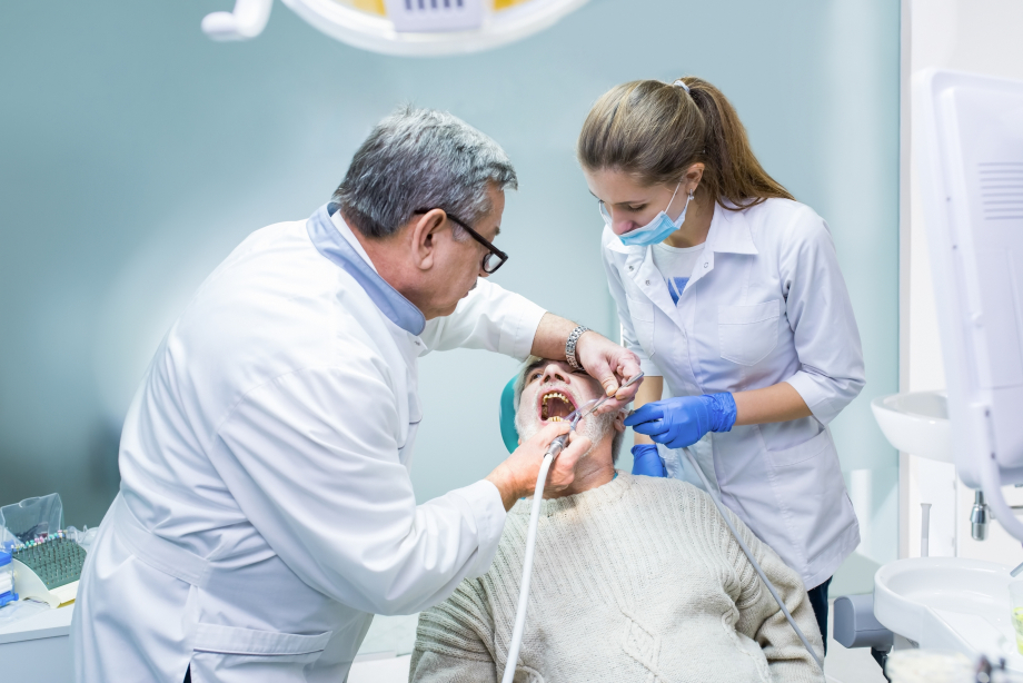 dentist and assistant at work
